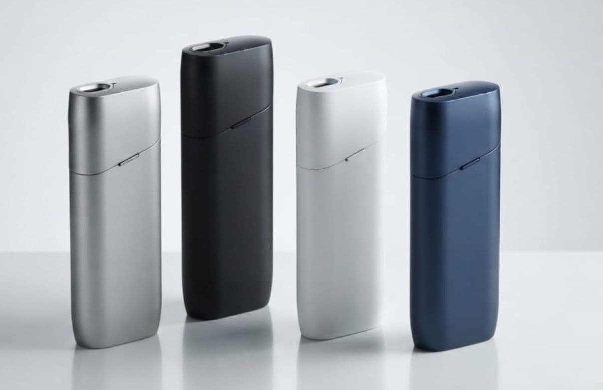A premium display of sleek IQOS Korea heated tobacco devices showing their pocket-friendly charging cases and elegant holder pens.